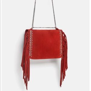 Red fringe split leather bag